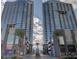Stunning exterior view of two modern, high-rise towers with blue glass and palm trees at 4525 Dean Martin Dr # 2901, Las Vegas, NV 89103
