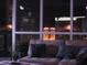 Cozy living room featuring a comfortable sofa, decorative pillows, and a dazzling city view at night at 4525 Dean Martin Dr # 2901, Las Vegas, NV 89103