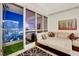 Cozy living room with comfortable seating, large windows, and balcony access for stunning city views at 4525 Dean Martin Dr # 2901, Las Vegas, NV 89103