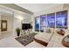 Inviting living room featuring a sectional sofa, modern decor, and a large window with city views at 4525 Dean Martin Dr # 2901, Las Vegas, NV 89103