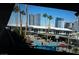 Resort-style pool area surrounded by palm trees and city views, perfect for relaxation and enjoyment at 4525 Dean Martin Dr # 2901, Las Vegas, NV 89103