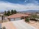 Aerial view of a well maintained single-story home with a three car garage and mature landscaping at 4650 Stoneham St, Pahrump, NV 89061