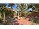 Serene backyard with shaded pergola over a brick patio and desert landscaping at 4650 Stoneham St, Pahrump, NV 89061