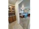 View from the hallway into the primary bedroom with a wood bed frame and matching dresser at 4650 Stoneham St, Pahrump, NV 89061