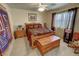 Cozy bedroom with a wood-framed bed, a cedar chest, and matching nightstands with decorative accents at 4650 Stoneham St, Pahrump, NV 89061