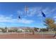 Community park with flagpoles, trees, and open space for recreation at 4650 Stoneham St, Pahrump, NV 89061