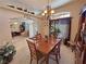 Bright dining area with a wooden table, chairs, and natural light, providing a warm and inviting atmosphere at 4650 Stoneham St, Pahrump, NV 89061