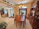 Inviting dining room with a wooden table, chairs, and built-in cabinet, perfect for Gathering gatherings and entertaining at 4650 Stoneham St, Pahrump, NV 89061