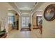 Elegant foyer featuring a double-door entrance and arched doorways at 4650 Stoneham St, Pahrump, NV 89061