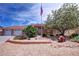 Beautiful single-story property showcases desert landscaping, charming statuary, and a spacious three-car garage at 4650 Stoneham St, Pahrump, NV 89061