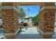 Lovely view of the front yard featuring a small statue, plants, and flag at 4650 Stoneham St, Pahrump, NV 89061