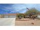 Lovely single-story house features a large driveway and desert landscaping with charming details at 4650 Stoneham St, Pahrump, NV 89061