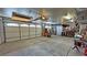 Spacious garage with ample storage, an oversized garage door, and concrete floors at 4650 Stoneham St, Pahrump, NV 89061