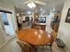 Eat-in kitchen features wood cabinets, tile floors, stainless appliances and leads to the living area at 4650 Stoneham St, Pahrump, NV 89061