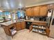 Kitchen displays stainless appliances and granite countertops with roll out drawers for storage at 4650 Stoneham St, Pahrump, NV 89061