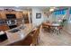 Eat-in kitchen featuring granite countertops, stainless steel appliances, and tile flooring at 4650 Stoneham St, Pahrump, NV 89061