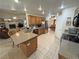 The bright kitchen features stone countertops, stainless appliances and an open view to the living room at 4650 Stoneham St, Pahrump, NV 89061