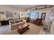 Bright living room featuring a fireplace, neutral decor and plush seating at 4650 Stoneham St, Pahrump, NV 89061