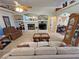 Relaxing living room with fireplace, and neutral decor at 4650 Stoneham St, Pahrump, NV 89061