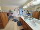 Bright bathroom featuring a jacuzzi tub, double sink vanity, and decorative accents at 4650 Stoneham St, Pahrump, NV 89061