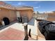Back patio with brick accents showing access to a utility area and trailer storage space at 4650 Stoneham St, Pahrump, NV 89061