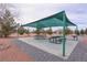 Shaded picnic area with tables and outdoor grill at 4650 Stoneham St, Pahrump, NV 89061