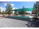 Outdoor picnic area with shaded seating and mature landscaping at 4650 Stoneham St, Pahrump, NV 89061