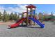 Community playground with slides and play structures for children at 4650 Stoneham St, Pahrump, NV 89061