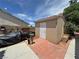 Enclosed storage shed with brick accents and surrounded by mature trees and landscaping at 4650 Stoneham St, Pahrump, NV 89061