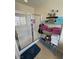 Shower with glass doors and shelves with folded towels at 4650 Stoneham St, Pahrump, NV 89061
