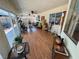 Bright sun room with wood floors and glass sliding door, leading to outdoor area at 4650 Stoneham St, Pahrump, NV 89061
