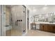 Spa-like bathroom with glass-enclosed shower, double vanity, and contemporary design at 490 Carter House Ave, Las Vegas, NV 89138