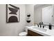 Stylish powder room features a modern vanity with white countertop and sleek fixtures at 490 Carter House Ave, Las Vegas, NV 89138