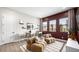 Bright and airy bedroom featuring comfortable seating, decor, and a view of the outdoor landscape at 490 Carter House Ave, Las Vegas, NV 89138
