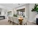Dining room with bright natural light and sliding doors to outdoor living space at 490 Carter House Ave, Las Vegas, NV 89138