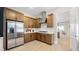Modern kitchen with stainless steel appliances and ample cabinet space at 490 Carter House Ave, Las Vegas, NV 89138