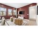 Comfortable living room featuring plush seating, natural light, and a view of the outdoor landscape at 490 Carter House Ave, Las Vegas, NV 89138