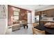 Stylish living room with modern furniture, decor, and a view of the kitchen with stainless steel appliances at 490 Carter House Ave, Las Vegas, NV 89138