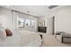 Bright bedroom features three windows, a comfortable bed, and neutral tones at 490 Carter House Ave, Las Vegas, NV 89138