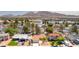 Exterior image of a single Gathering home featuring desert landscaping, palm trees, and mountain views at 4916 Carmichael Ave, Las Vegas, NV 89110