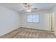 Cozy bedroom featuring neutral carpet and a ceiling fan at 4916 Carmichael Ave, Las Vegas, NV 89110
