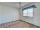 Bright bedroom with neutral carpet and a window with blinds at 4916 Carmichael Ave, Las Vegas, NV 89110