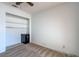 Neutral carpeted bedroom with walk-in closet with built-in shelves at 4916 Carmichael Ave, Las Vegas, NV 89110