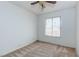 Carpeted bedroom with a ceiling fan and a window providing natural light at 4916 Carmichael Ave, Las Vegas, NV 89110