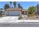 Charming single-story home with a two-car garage and desert landscaping at 4916 Carmichael Ave, Las Vegas, NV 89110