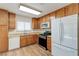 Well lit kitchen featuring stainless steel appliances, wood cabinets, and wood floor at 4916 Carmichael Ave, Las Vegas, NV 89110