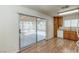 Kitchen with wood floors, wood cabinets, and sliding glass doors to backyard at 4916 Carmichael Ave, Las Vegas, NV 89110