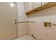 Laundry room with upper cabinets and hook ups for washer and dryer at 4916 Carmichael Ave, Las Vegas, NV 89110
