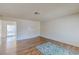Open living room with hardwood floors and sliding door access at 4916 Carmichael Ave, Las Vegas, NV 89110