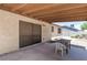 Covered backyard patio with outdoor seating area at 4916 Carmichael Ave, Las Vegas, NV 89110